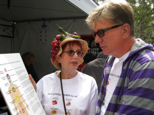 Pat with customer at Festival of Books